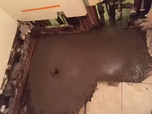 Concrete slab opened and patched after a slab leak under tile flooring in Garden Grove